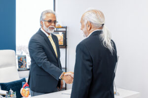 A patient and provider shake hands after developing a treatment plan for managing heart failure disease.